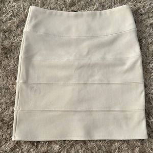 Body contour white mini skirt.